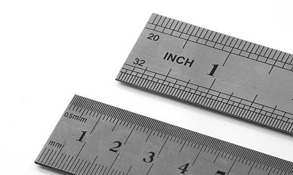 two grey rulers displaying different scales